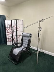 A chair and microphone in a room.